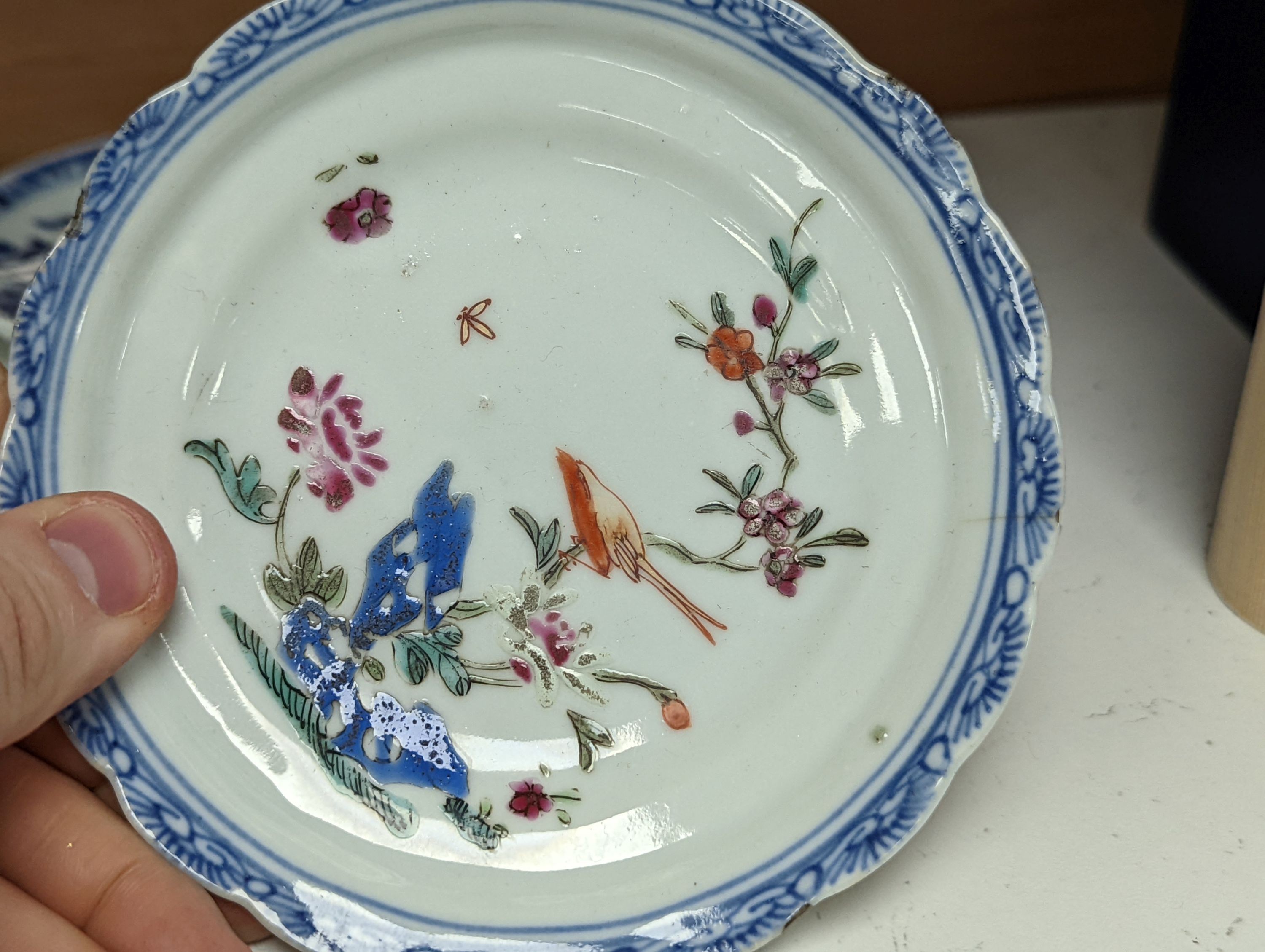Seven 18th century Chinese saucer dishes, largest 14 cms diameter.